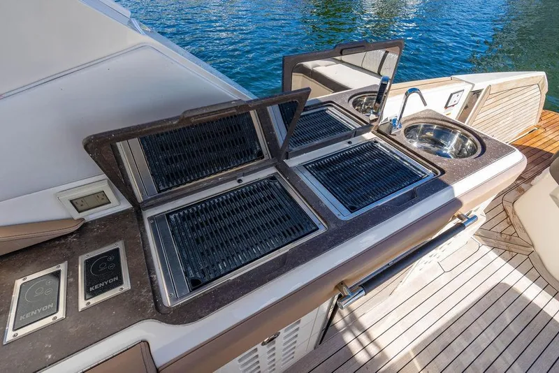 Slide: The Image of Outdoor kitchen on 2019 Sea Ray SLX 400 Outboard yacht with grill and sink. - 31