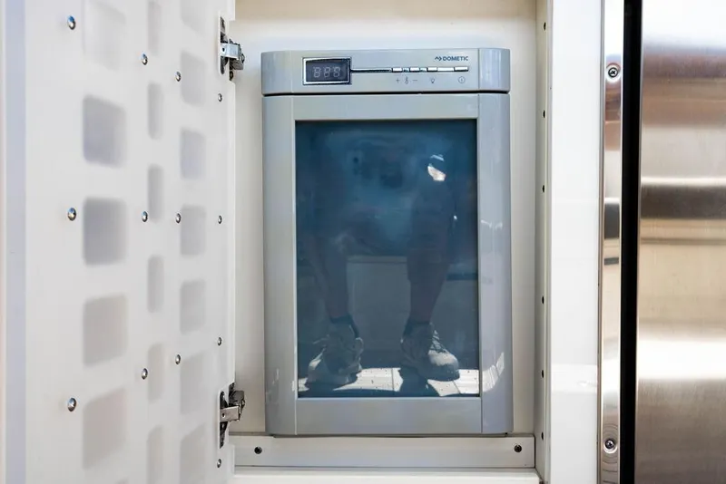 Slide: The Image of Built-in Dometic refrigerator on 2019 Sea Ray SLX 400 Outboard boat. - 32