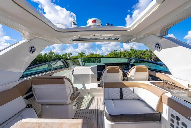 Slide: The Image of Luxurious 2019 Sea Ray SLX 400 Outboard interior with plush seating and modern design. - 34