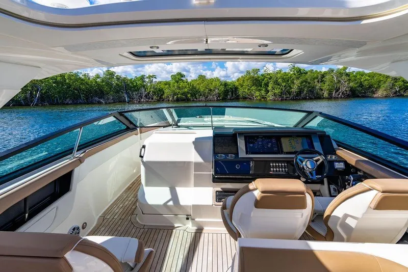 Slide: The Image of 2019 Sea Ray SLX 400 Outboard cockpit with luxurious seating and advanced navigation system. - 35