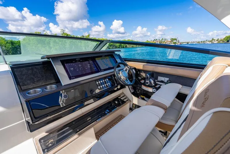 Slide: The Image of Luxurious 2019 Sea Ray SLX 400 Outboard helm with modern controls and scenic water view. - 36