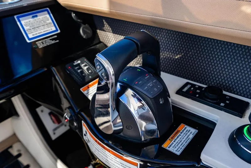 Slide: The Image of Control panel of 2019 Sea Ray SLX 400 Outboard boat with throttle and navigation controls. - 41
