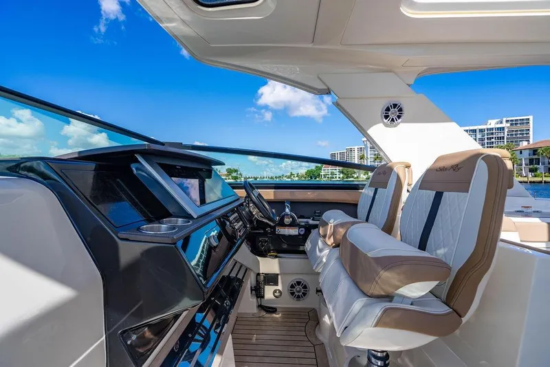 Slide: The Image of 2019 Sea Ray SLX 400 Outboard cockpit with luxurious seating and modern controls. - 42