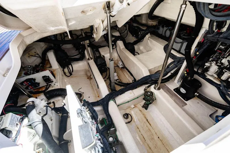 Slide: The Image of Engine compartment of 2019 Sea Ray SLX 400 Outboard, showcasing mechanical components and wiring. - 43
