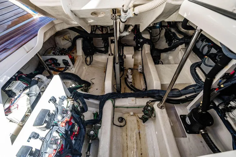 Slide: The Image of Engine compartment of 2019 Sea Ray SLX 400 Outboard, showcasing wiring and mechanical components. - 44