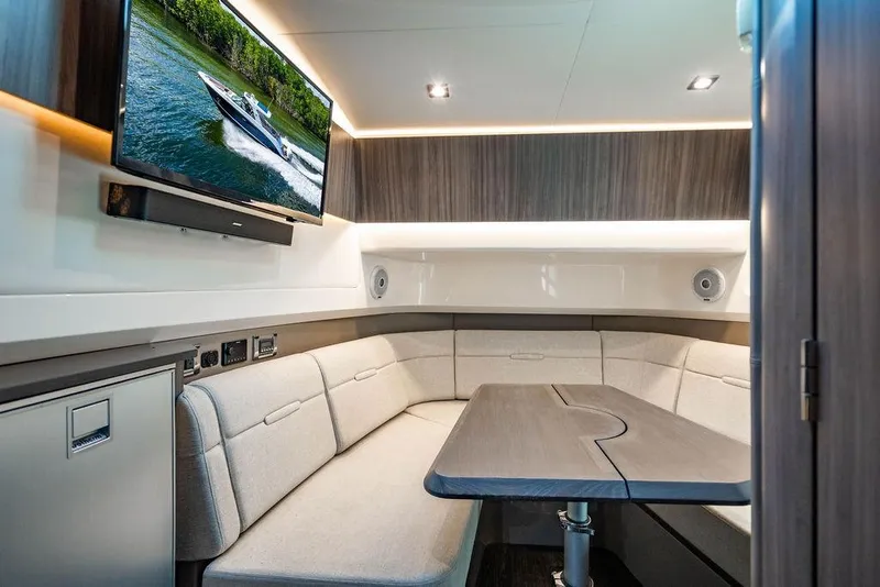 Slide: The Image of Luxurious interior of 2019 Sea Ray SLX 400 Outboard with plush seating and modern amenities. - 57