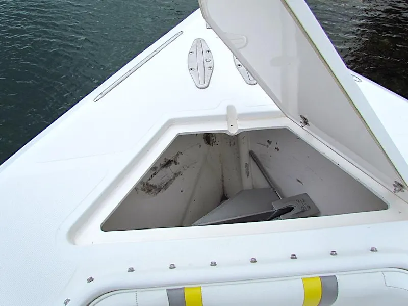 Slide: The Image of Open anchor storage on 2005 Venture 34 Open boat, showing clean compartment. - 10