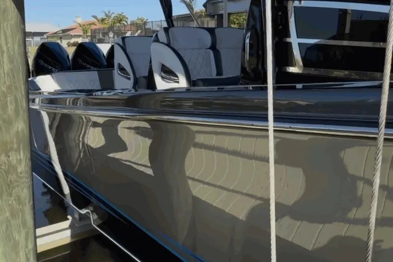 Slide: The Image of 2022 Nor-Tech 390 Sport boat docked, featuring sleek design and luxurious seating. - 20