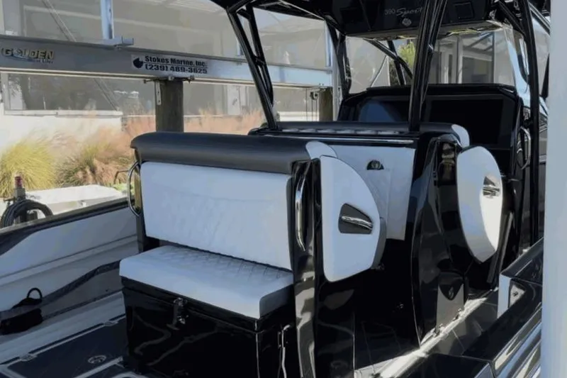 Slide: The Image of 2022 Nor-Tech 390 Sport interior with sleek black and white seating design. - 7