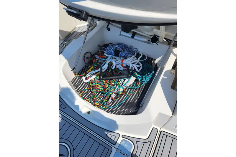Slide: The Image of Storage compartment of a 2013 Monterey 260 SCR boat with colorful ropes. - 13