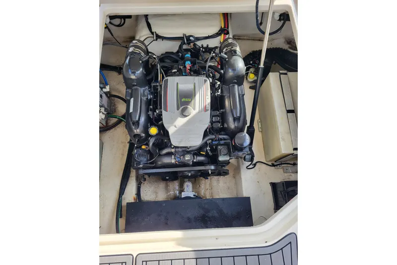 Slide: The Image of Engine compartment of a 2013 Monterey 260 SCR boat, showcasing detailed mechanical components. - 15