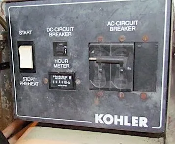 Slide: The Image of Control panel of a Kohler generator with switches and hour meter, model Hyatt 55, 1997. - 30