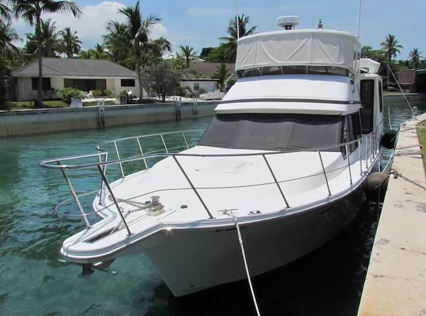 Slide: The Image of Luxury yacht docked in tropical marina, Hyatt 55 model, 1997. - 4