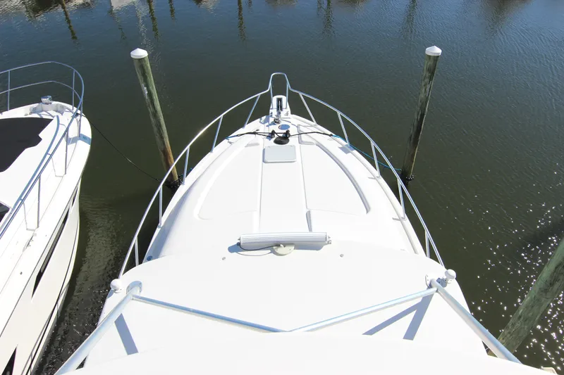 Slide: The Image of 2008 Bertram 360 yacht docked at marina, aerial view of bow and water. - 18