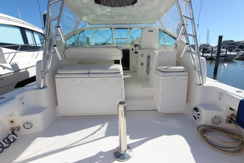 Slide: The Image of 2008 Bertram 360 boat interior with seating, docked at marina. - 19