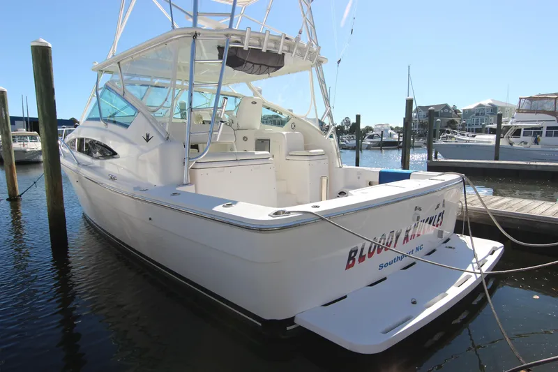 Slide: The Image of 2008 Bertram 360 boat docked in marina, Southport NC, sunny day. - 2