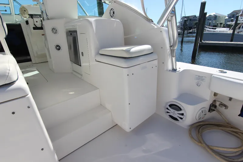 Slide: The Image of 2008 Bertram 360 yacht interior with seating, steps, and marina view. - 21
