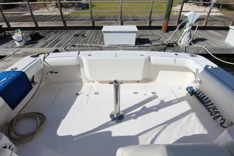 Slide: The Image of 2008 Bertram 360 boat deck with seating, docked at marina. - 22
