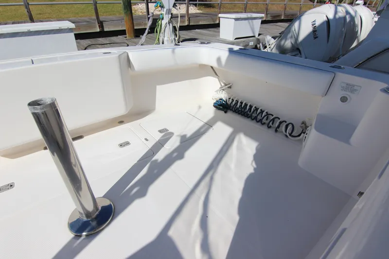 Slide: The Image of 2008 Bertram 360 boat deck with coiled hose and stainless steel post. - 26