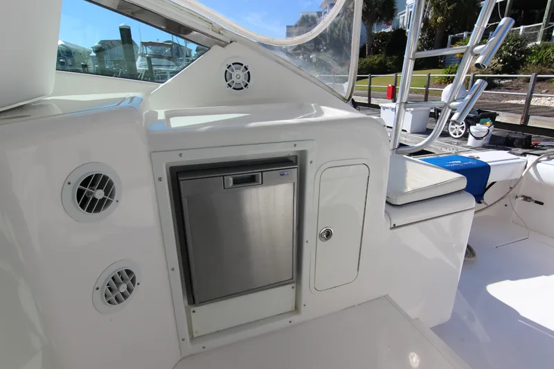 Slide: The Image of 2008 Bertram 360 yacht interior with stainless steel fridge and seating area. - 28