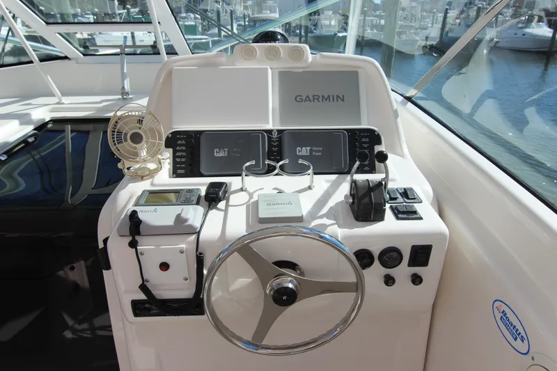 Slide: The Image of 2008 Bertram 360 boat helm with Garmin navigation and control systems. - 29