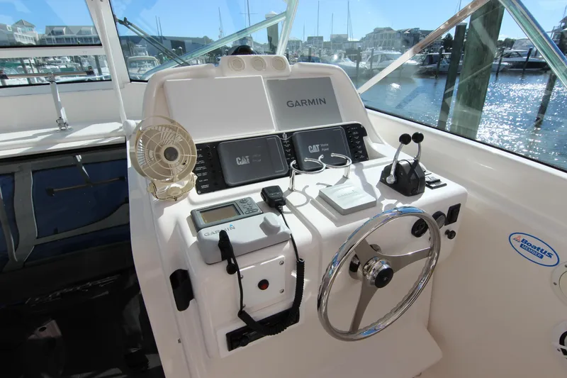 Slide: The Image of Helm of 2008 Bertram 360 with Garmin navigation and CAT engine displays. - 30