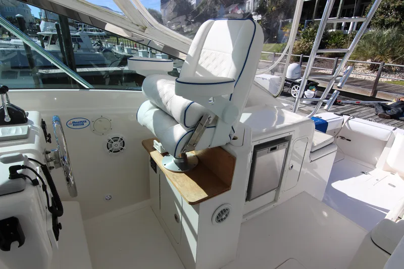 Slide: The Image of 2008 Bertram 360 boat interior with helm seat and control panel. - 32