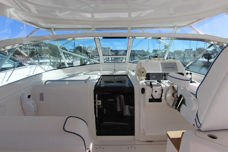 Slide: The Image of 2008 Bertram 360 yacht cockpit with Garmin navigation, docked at marina. - 37