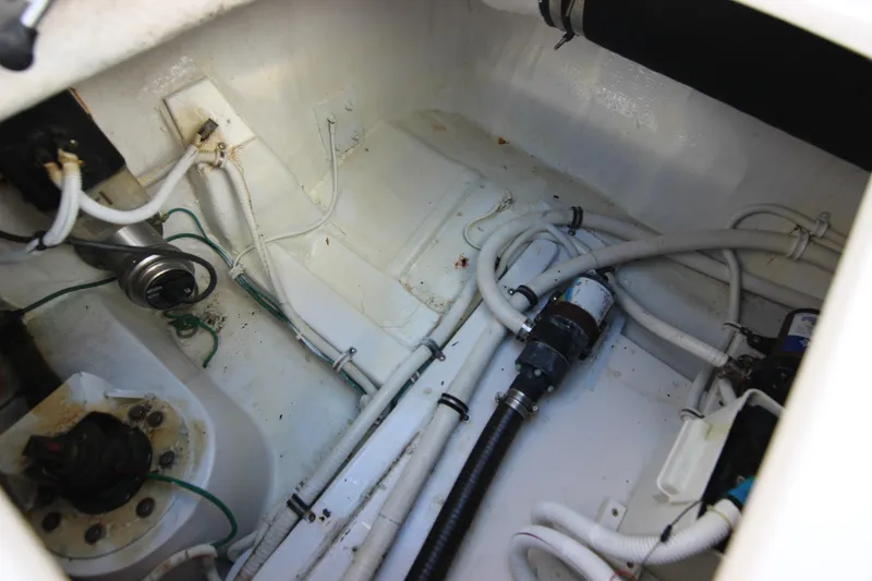 Slide: The Image of Engine compartment of a 2008 Bertram 360 boat, showing wiring and plumbing. - 49