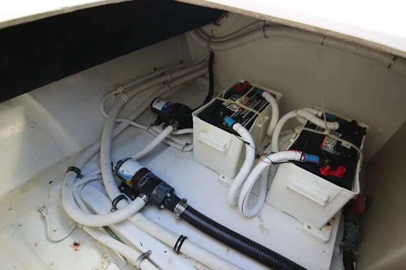 Slide: The Image of Engine compartment of 2008 Bertram 360 with batteries and wiring. - 50