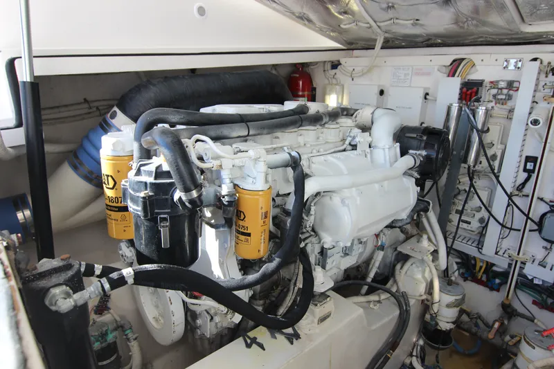 Slide: The Image of Engine room of a 2008 Bertram 360 yacht, showcasing detailed machinery and components. - 52