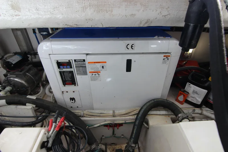 Slide: The Image of Engine room of a 2008 Bertram 360 with Kohler generator and various equipment. - 55