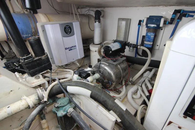 Slide: The Image of Engine room of a 2008 Bertram 360 boat with Dolphin Pro 3210 charger. - 56
