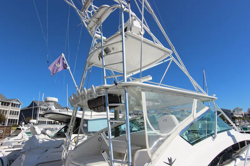 Slide: The Image of 2008 Bertram 360 yacht docked at marina under clear blue sky. - 6