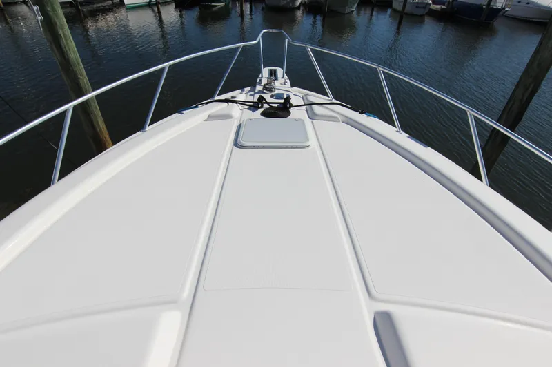 Slide: The Image of Bow view of a 2008 Bertram 360 yacht docked at a marina. - 8