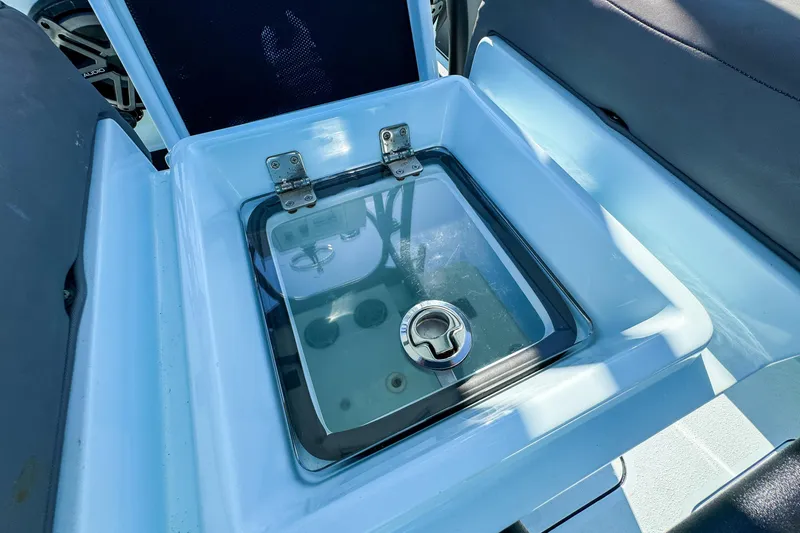 Slide: The Image of 2019 Yellowfin 26 Hybrid boat livewell with clear lid and secure latch. - 18