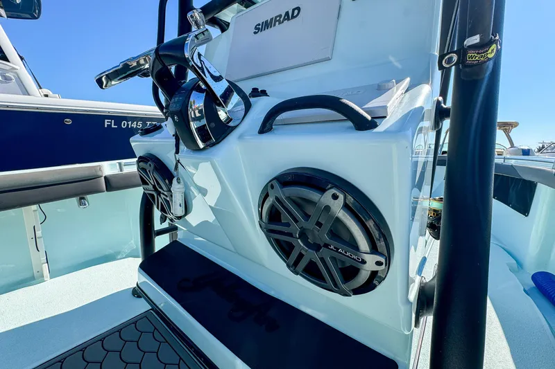 Slide: The Image of 2019 Yellowfin 26 Hybrid boat console with Simrad electronics and JL Audio speakers. - 20