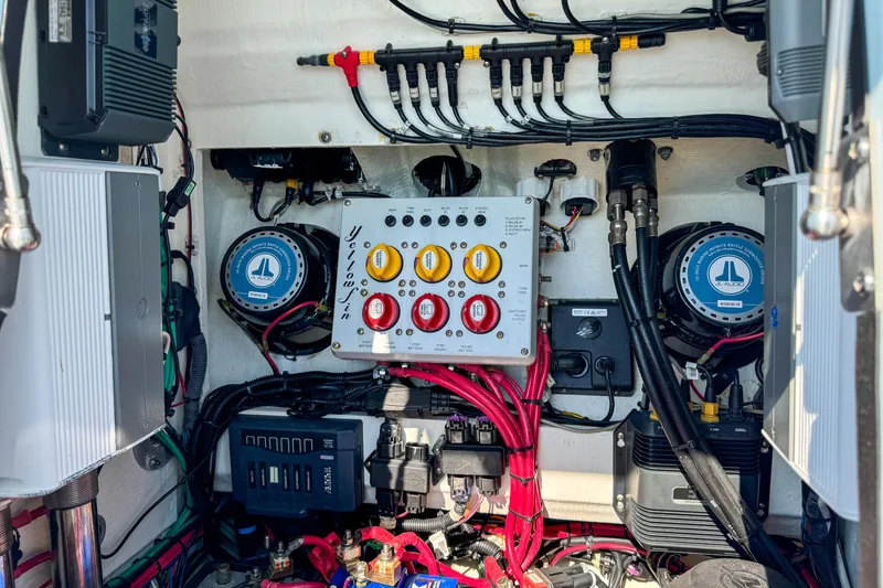 Slide: The Image of Electrical system of a 2019 Yellowfin 26 Hybrid boat, featuring wiring and control panel. - 28