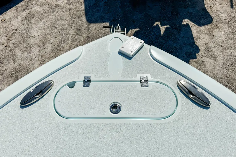 Slide: The Image of 2019 Yellowfin 26 Hybrid boat deck with cleats and hatch, viewed from above. - 30