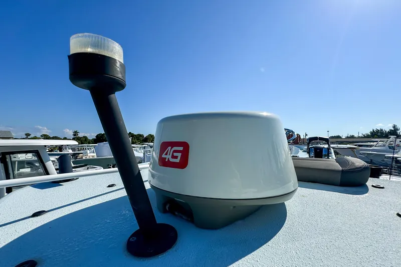 Slide: The Image of 2019 Yellowfin 26 Hybrid boat with 4G radar and navigation light under clear blue sky. - 35