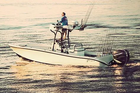 Slide: The Image of Manufacturer Provided Image: 2019 Yellowfin 26 Hybrid boat cruising on calm waters at sunset. - 37