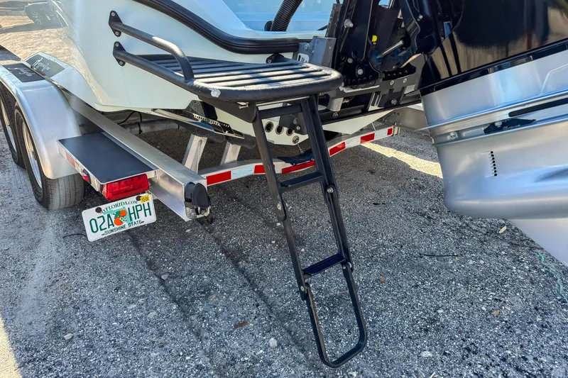 Slide: The Image of 2019 Yellowfin 26 Hybrid boat on trailer with ladder and Florida license plate. - 5