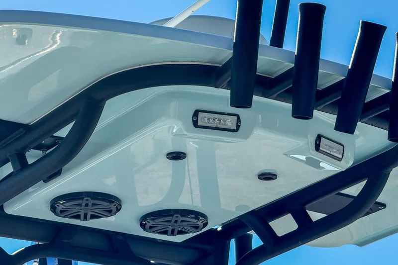 Slide: The Image of 2019 Yellowfin 26 Hybrid boat T-top with speakers and rod holders. - 6