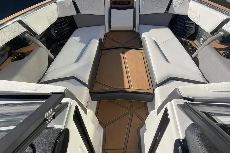 Slide: The Image of Interior of 2025 Nautique Super Air Nautique G25 Paragon boat, featuring luxurious seating. - 11