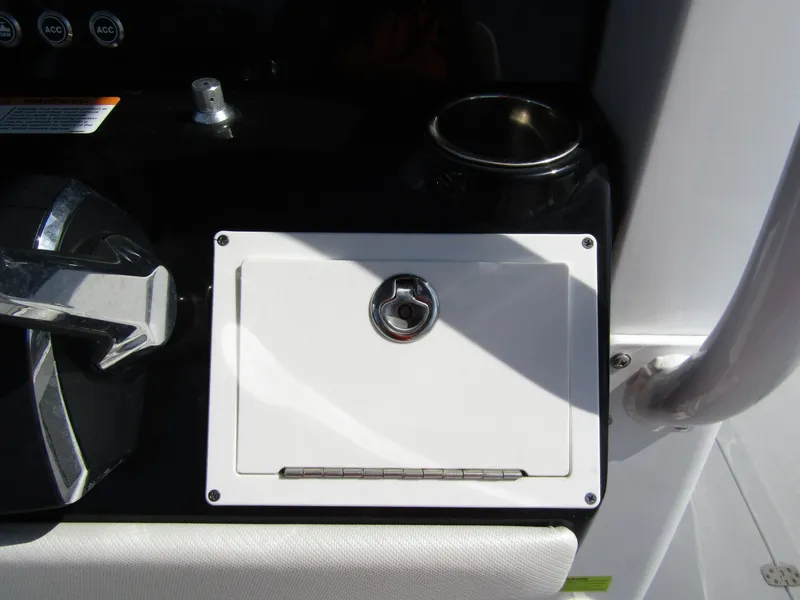 Slide: The Image of 2024 Wellcraft 263 Fisherman console with control lever and storage compartment. - 21