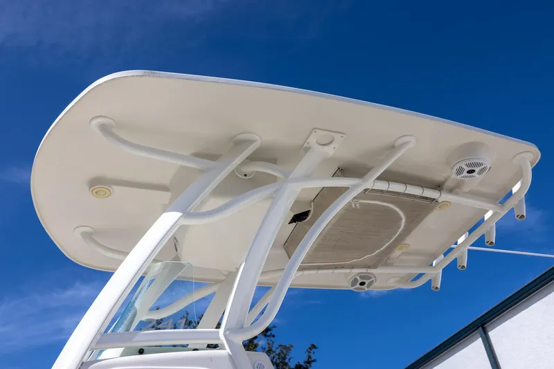 Slide: The Image of 2018 Sailfish 241 CC boat's T-top against a clear blue sky. - 10