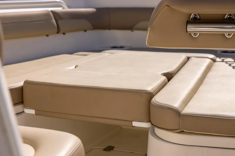 Slide: The Image of 2018 Sailfish 241 CC boat interior with beige cushioned seating. - 26