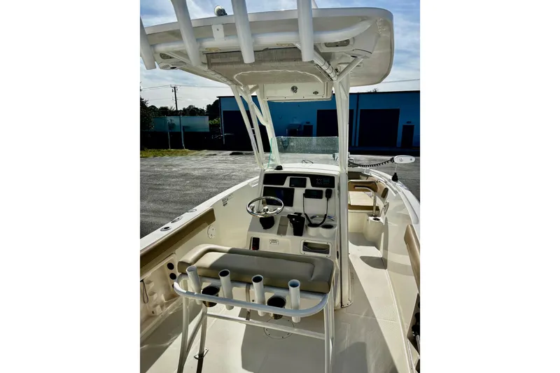Slide: The Image of 2018 Sailfish 241 CC boat interior with steering console and seating. - 3