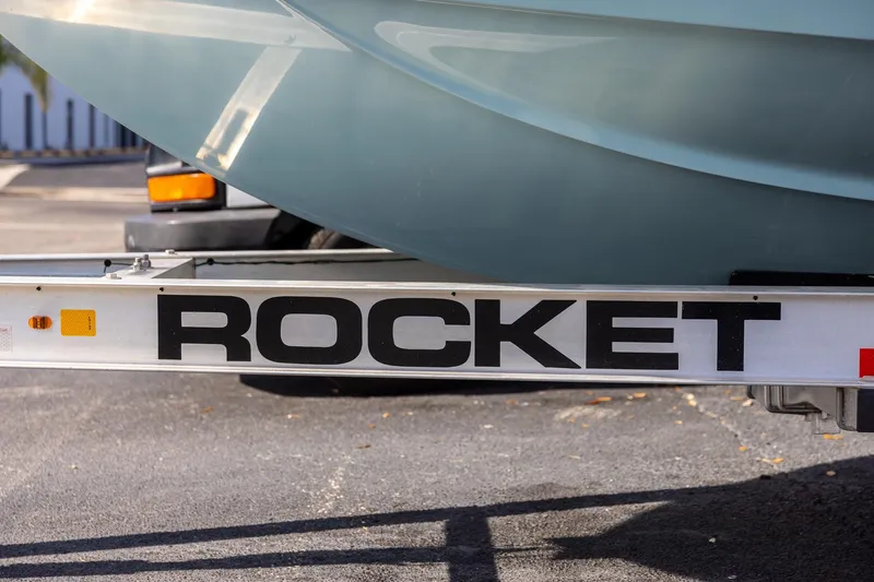 Slide: The Image of 2018 Sailfish 241 CC boat on Rocket trailer, parked outdoors. - 32
