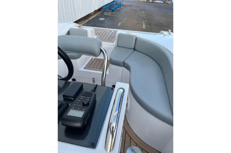 Slide: The Image of 2021 Novurania Chase 19 boat interior with seating and control panel. - 6